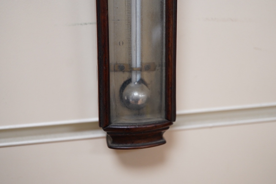 A Georgian mahogany cased thermometer by J. Newman, 122 Regent St., London, with silvered scale and bevelled glass front, 44.5cm high